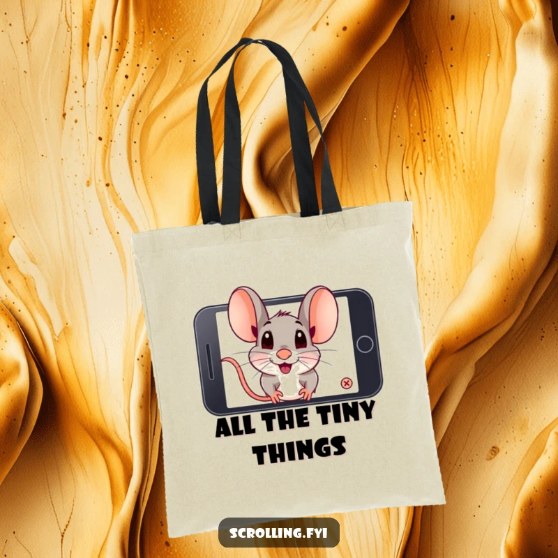 Funny playful mouse intensely zooming in on a smartphone screen. Perfect funny tote bag.